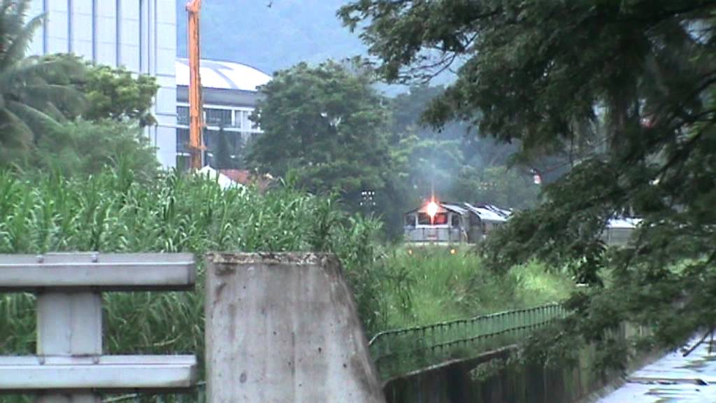 KTM Passenger Train passing Choa Chu Kang Road Crossing towards M'sia