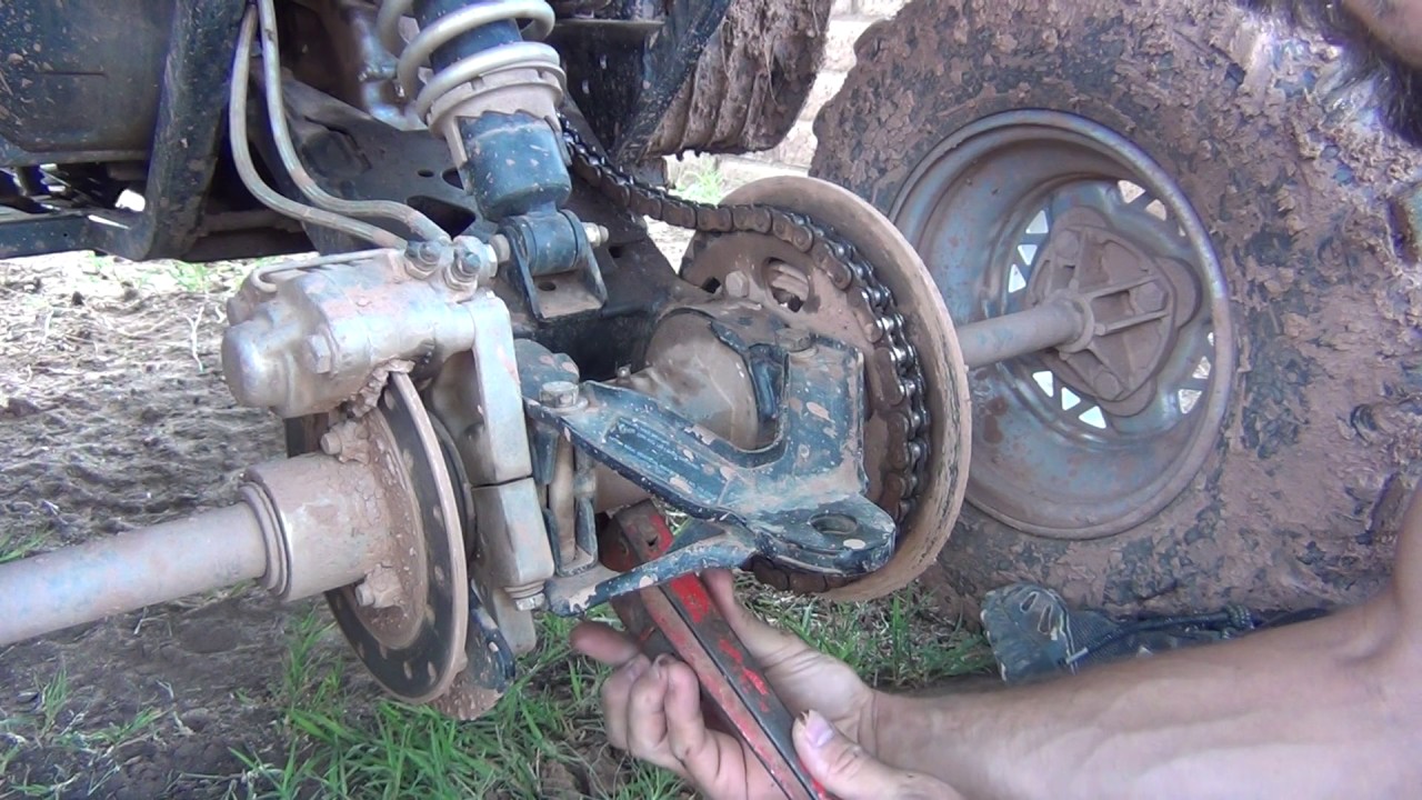 How to tighten a chain on a Polaris Scrambler 500 - Trail Boss 330