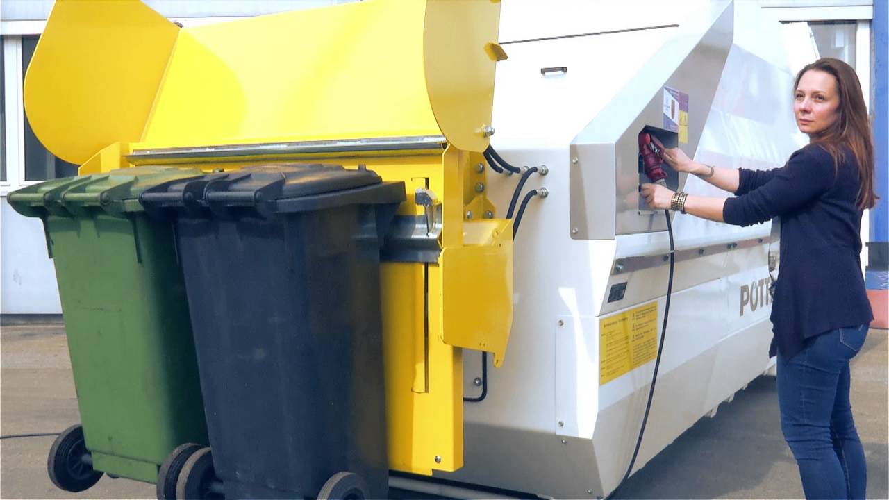 Bin lift system with hydraulic comb Pöttinger Entsorgungstechnik [en]