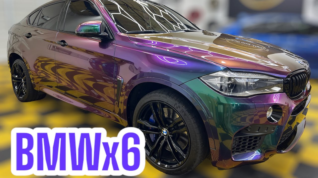 BMW X6 Full Wrapped In Galaxy Green Color Shift Vinyl installed by Jekyll and Hydes Custom Car Wraps