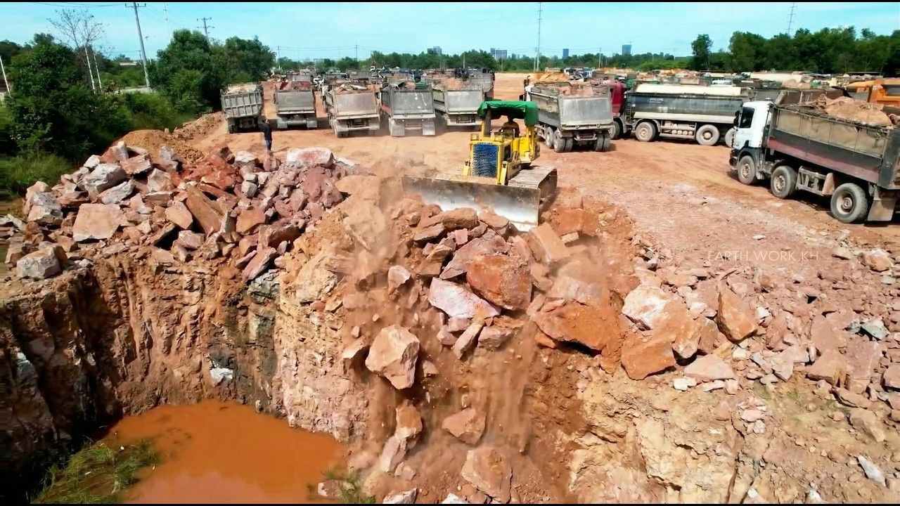 Smoothly Running Machines Komatsu Bulldozer Moving Stones With Expert Driver Skills Moving earth