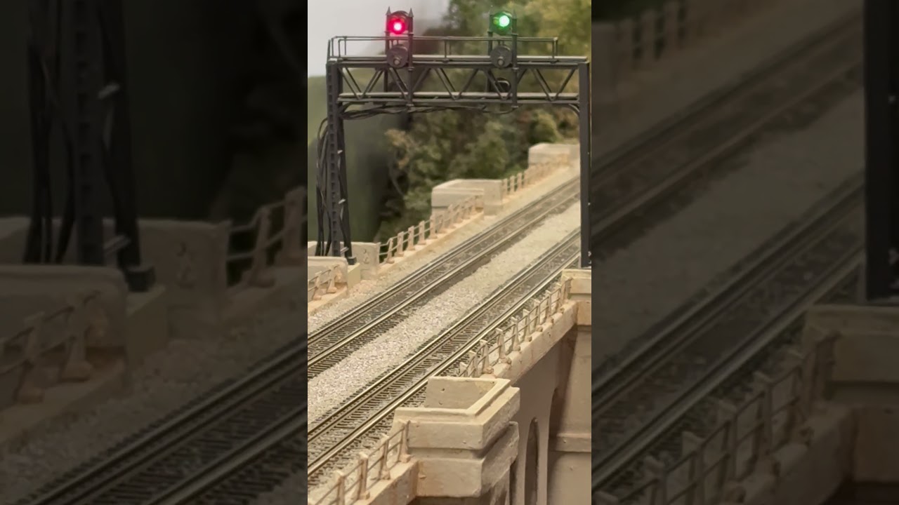War Department #101 heads west light engine over the viaduct