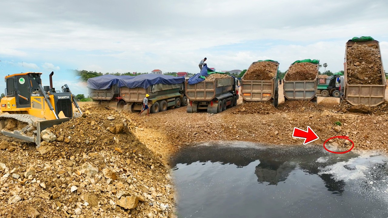 Wonderful Complete Soil Filling by Two Skills SHANTUI Dozer Pushing Rock And several rock trucks