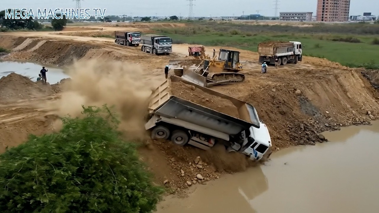 OMG!! dump truck 25.5 t fail into deep water and dozer pushing soil delete pond