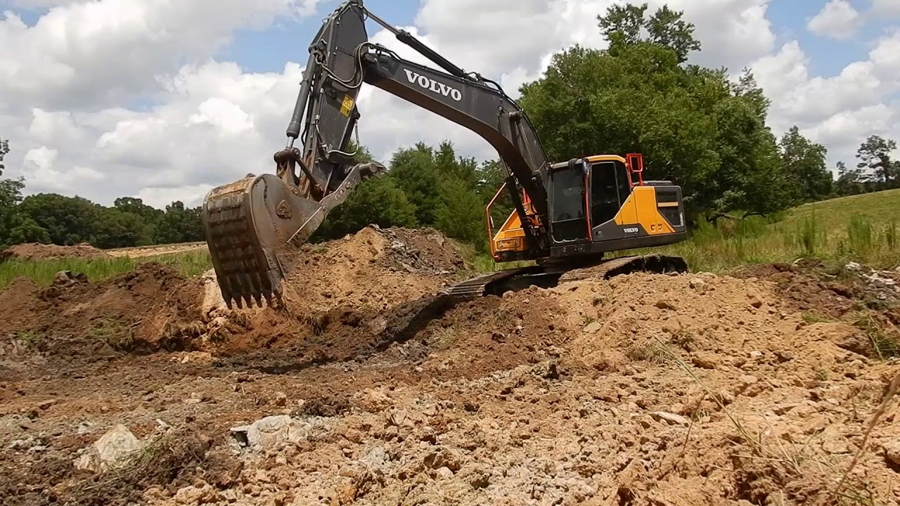 Excavator Dredging Out The Cow Pond