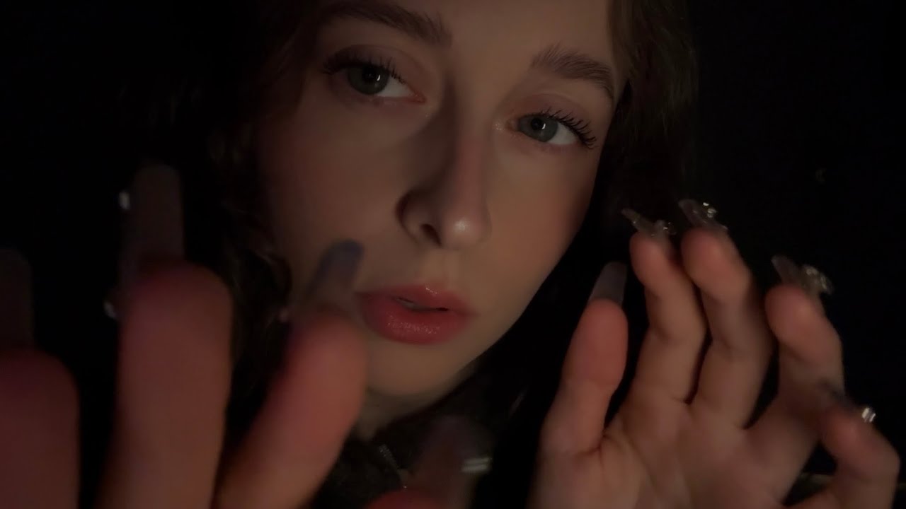 ASMR close up lens taps with inaudible whispers