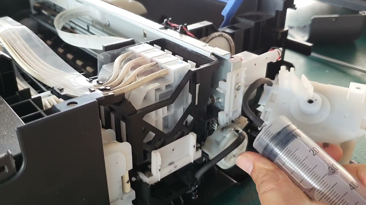 mi impresora Epson imprime con rayas problema en la bomba de succión