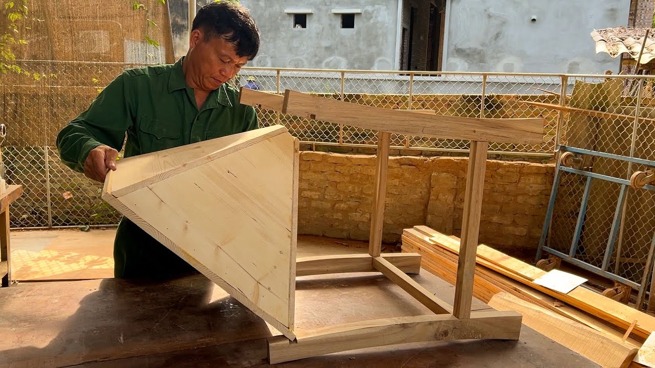 Woodworking: The carpenter creates a unique triangular cabinet a wonderful process