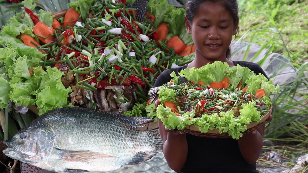 Yummy cook fish salad sour sweet tasty with Carrots cucumber for Food of survival in the forest