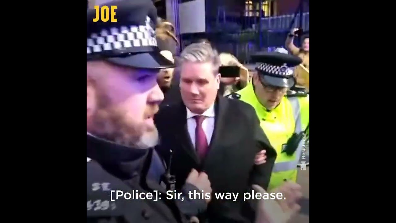Conspiracy theorists chase Keir Starmer into a police car