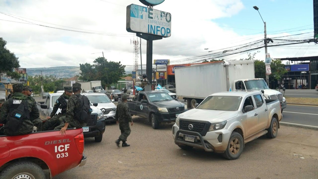 Ballots in Honduras' tightly-contested election transported under heavy military guard | AFP