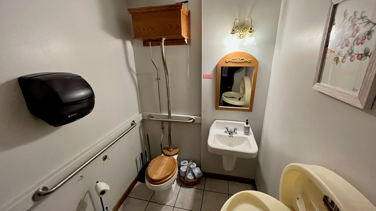 Bathroom tour: High mount tank Eljer Toilet in a General Store