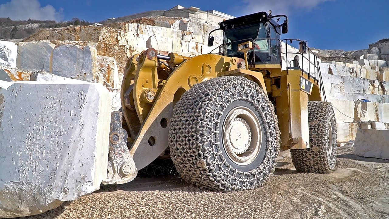 Few inches away from a Caterpillar 993K Wheel Loader and a huge marble slab.