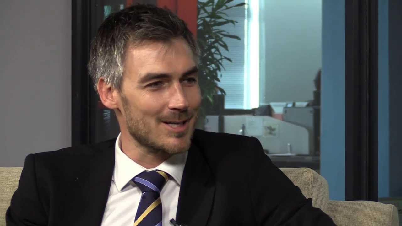 Does Tim Harris feel objectified because of his good looks?