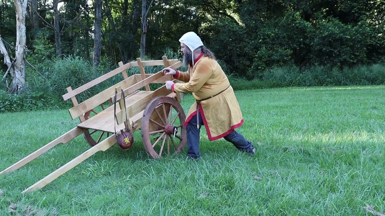 Medieval handcart versus bentley