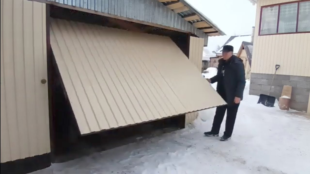 Необычный подъемным механизм гаражных ворот