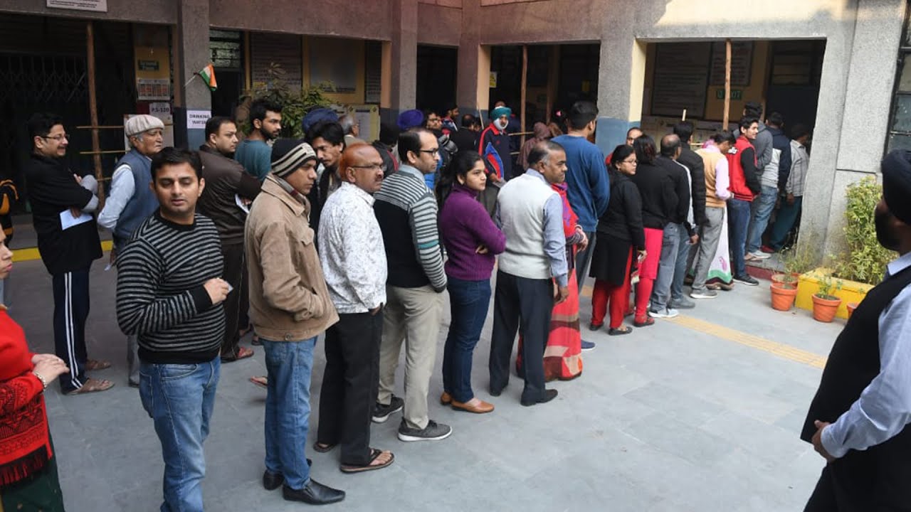 Delhi: Voters queue outside polling booths as voting for legislative assembly elections is underway