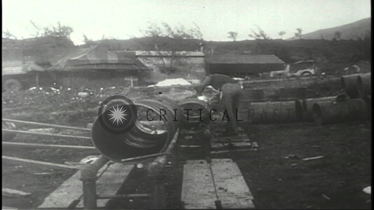 US Navy CBs (Construction Battalions) on Guam, Mariana Islands turn empty oil dru...HD Stock Footage