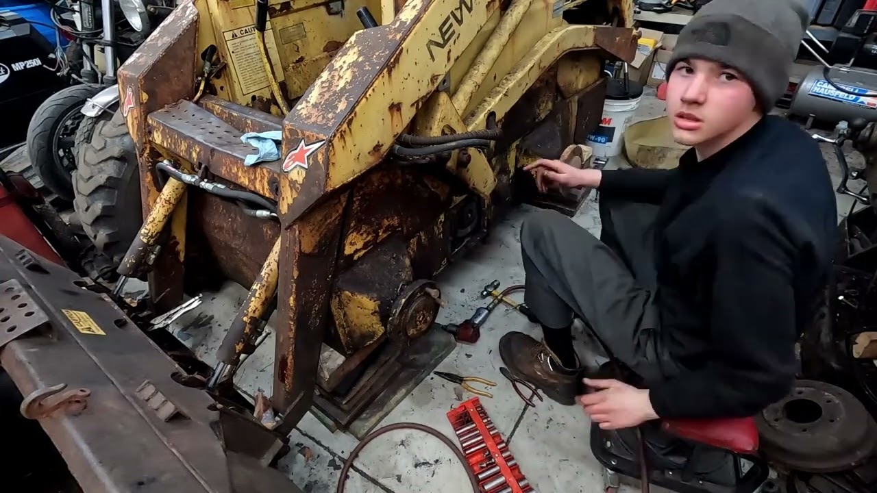 Replacing A Axle Seal On A New Holland Skid Steer