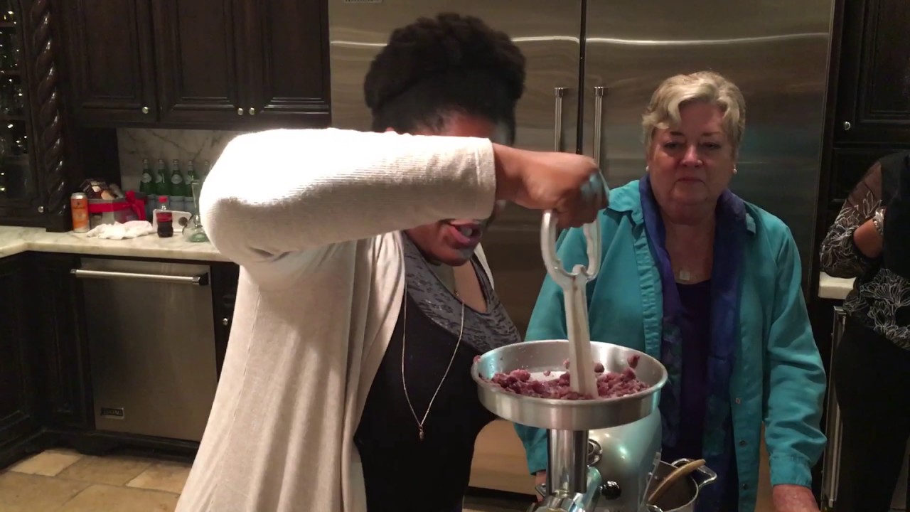 DeOnzell sings while making sausage