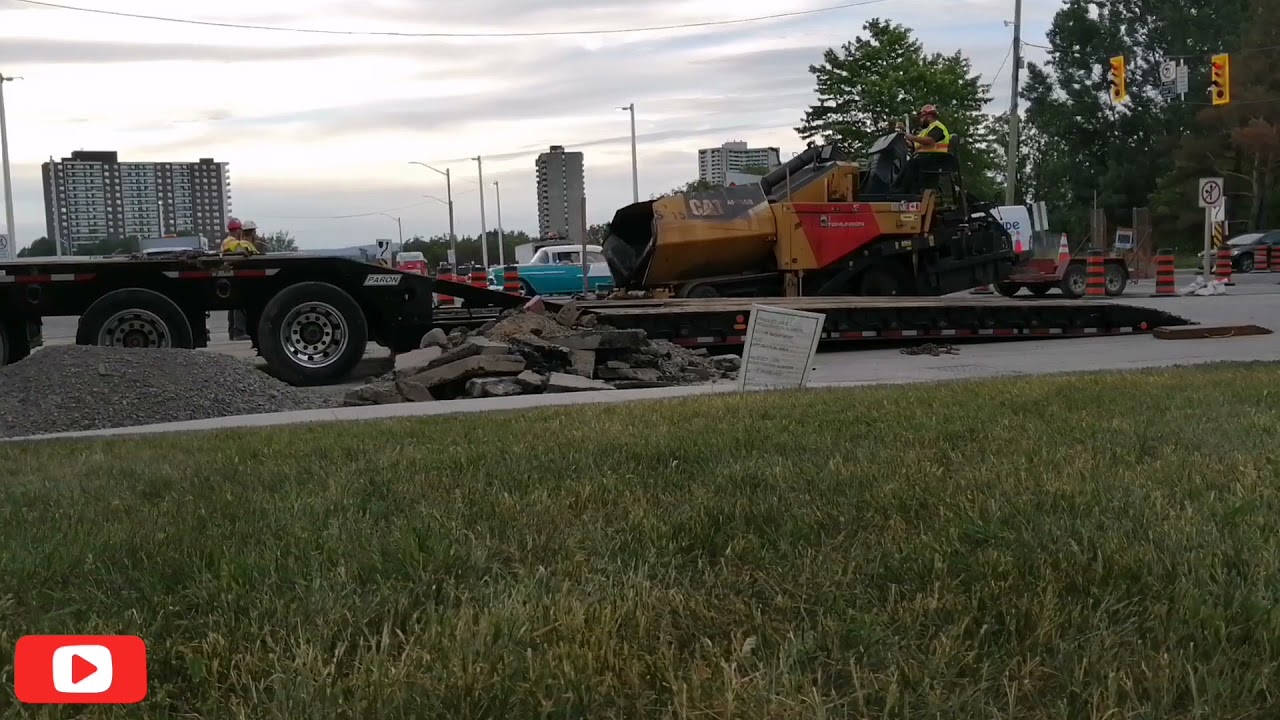 Loading a Cat CB64 roller + asphalt paver AP655D on a Paron float with a Kenworth truck