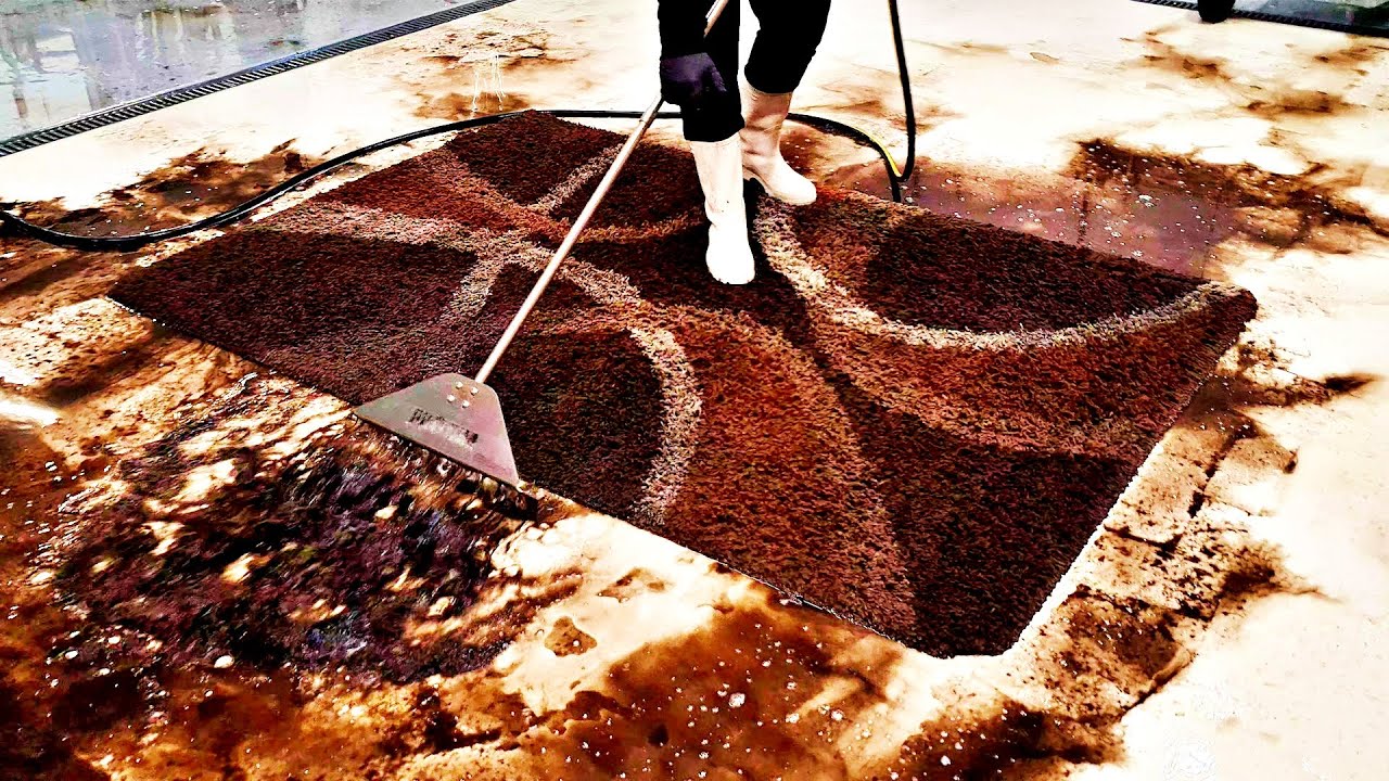 Unbelievable layers of mud flowing out of the Shaggy rug. Sebastian style restoration rug cleaning.