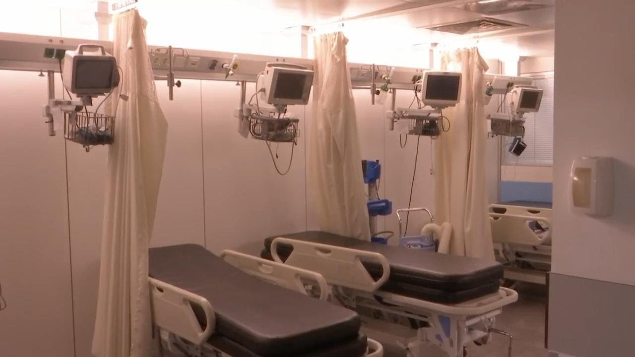 Journalists taken on a tour of the Beirut hospital where Israel claimed Hezbollah stored cash and go