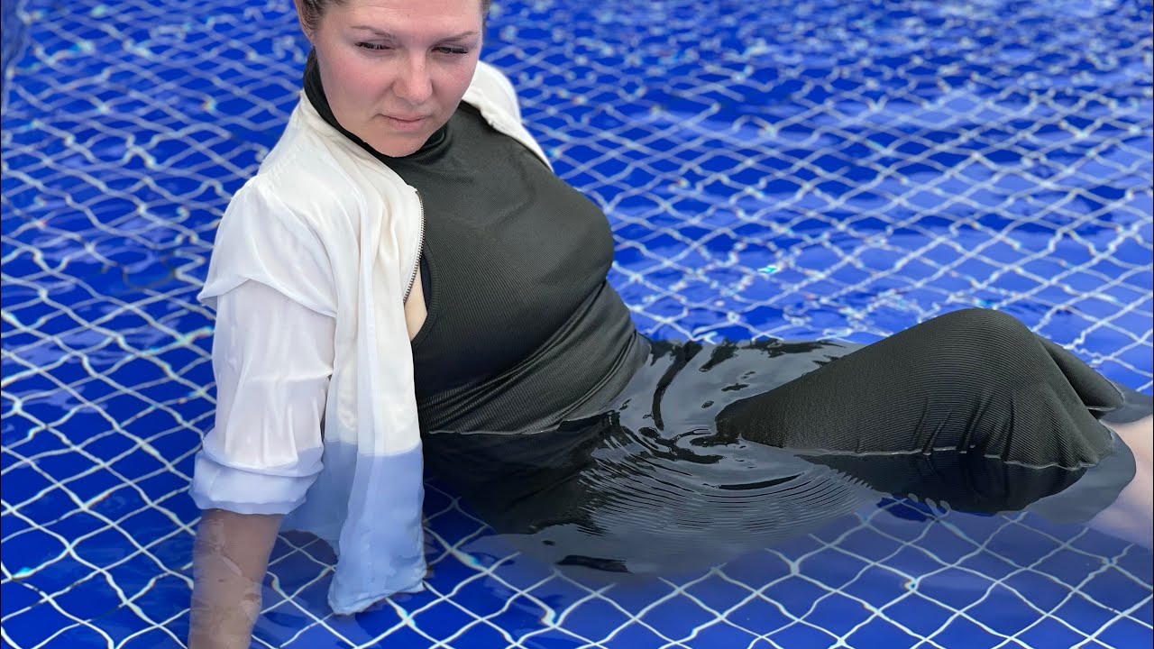 Green long dress, white jacket, nylon socks. Wetlook pool video.