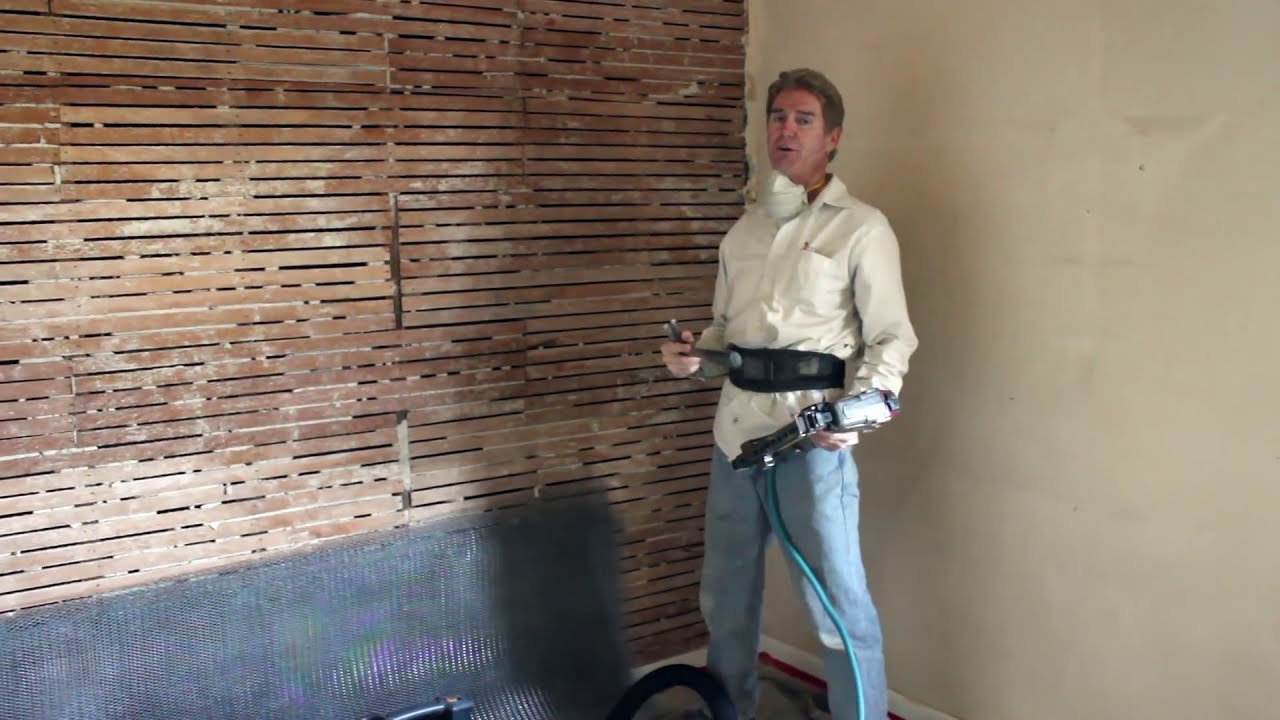 Plastering interior walls for strength with stucco.