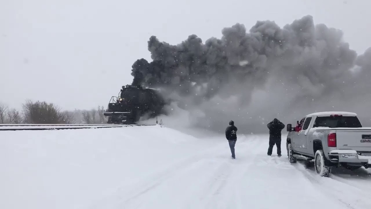 Union Pacific Big Boy in the Kansas snow pulling passenger cars and Freight