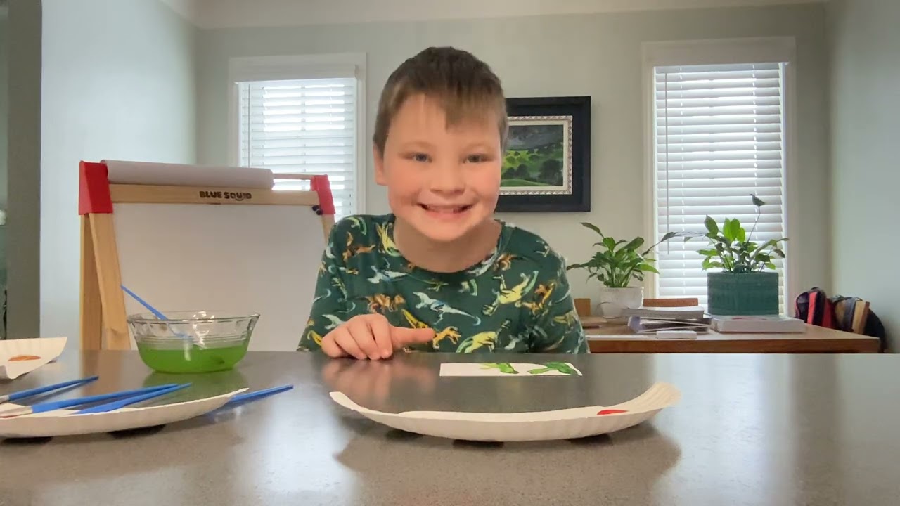 Charlie paints letters again with water