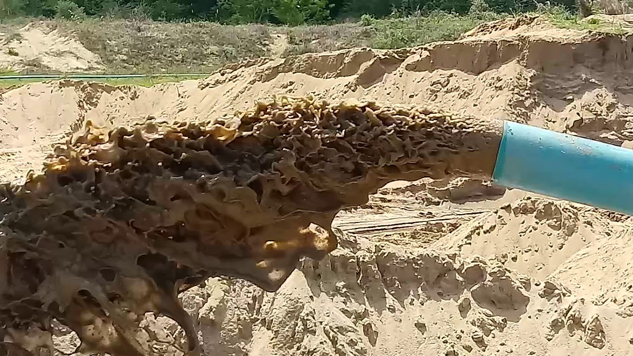 draga sugando areia no rio da Paraíba