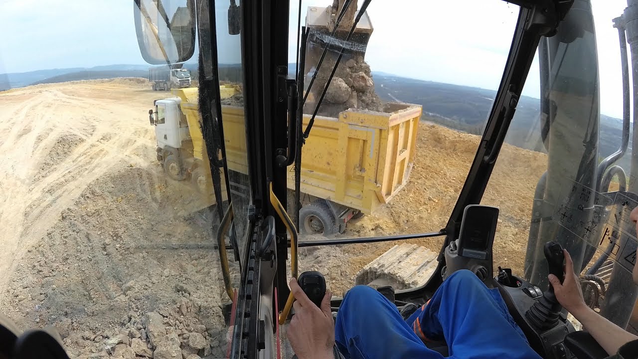 Excavator Volvo EC380D loads trucks #4
