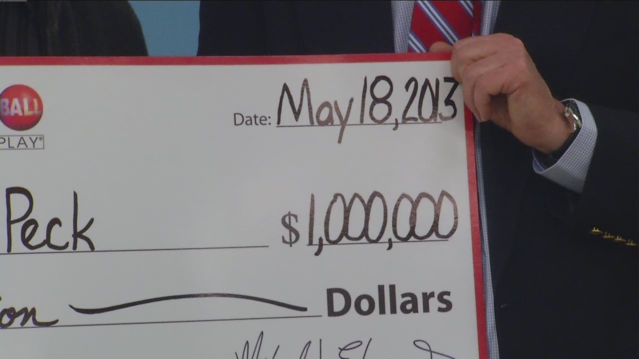 $1 million Powerball winner proposes during check presentation