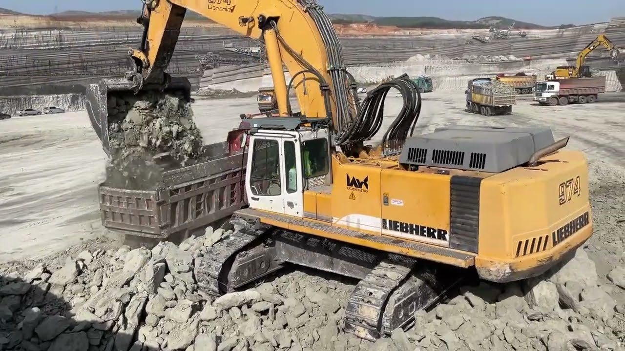 Liebherr 974 Excavator Loading Mercedes And MAN Trucks