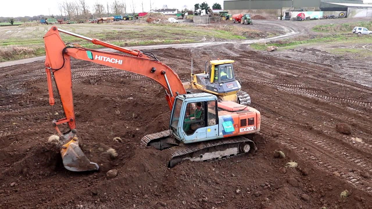 Reclaiming land | Hitachi and Komatsu