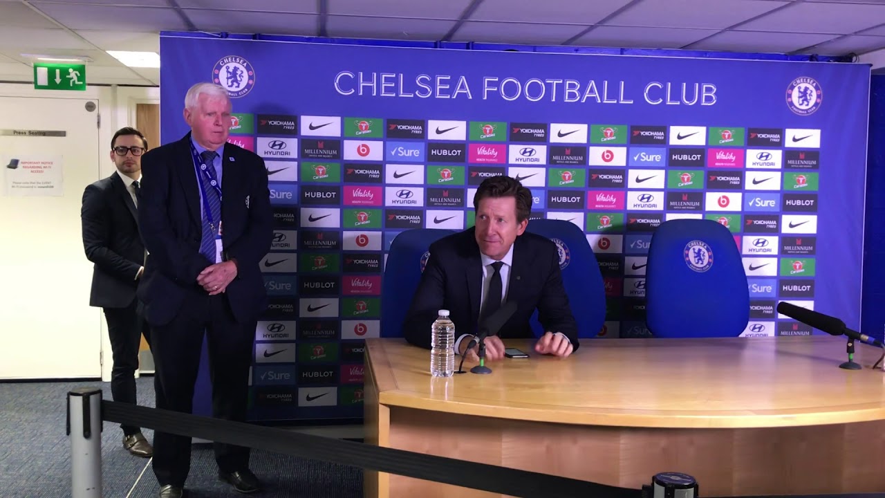 Chelsea chairman Bruce Buck presents Brian Pullman with cake and flowers at Stamford Bridge