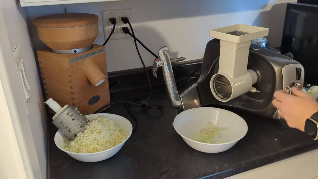 Ankarsrum mixer with vegetable shredding attachments used to process cabbage