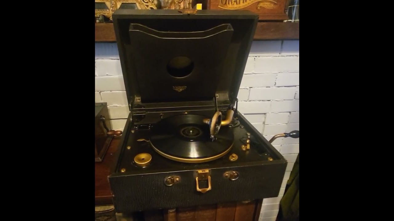 Portable 2-60 Victrola. Reglued shattered pot metal reproducer, & dampened with coinholder material