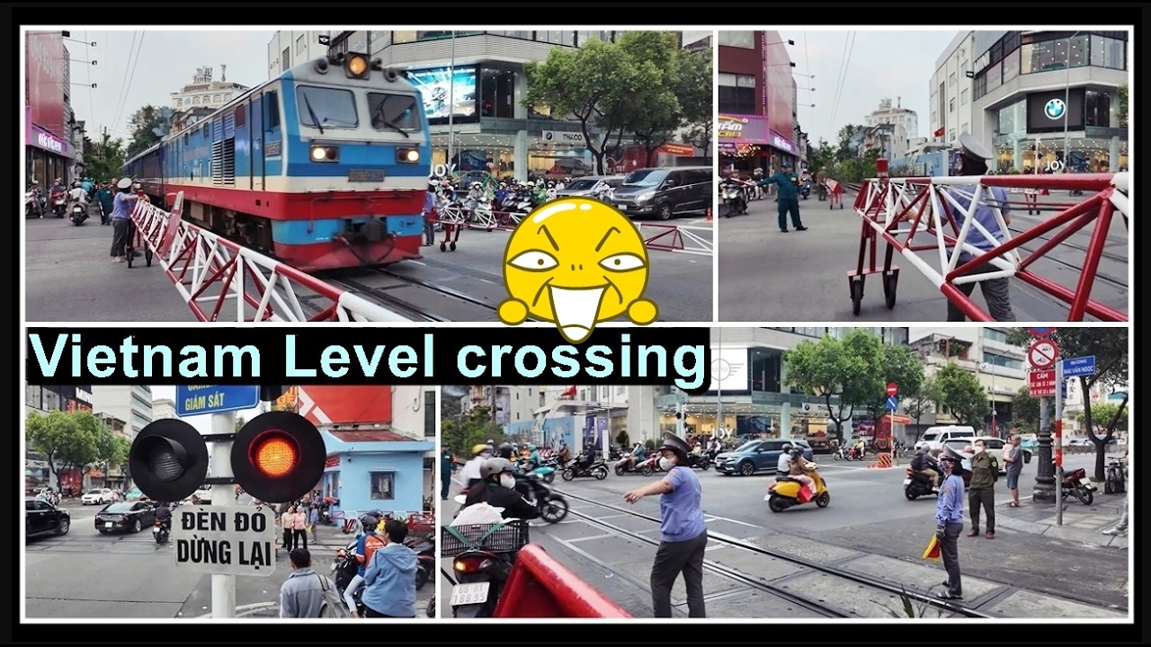 Grosser Bahnübergang mit Rollschranken bei Saigon, Vietnam 2026