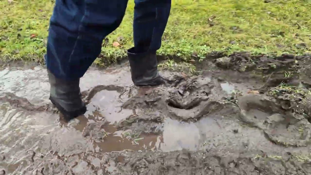 Short high-heel leather boots on a muddy path