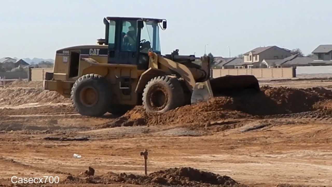 CAT 938G Wheel Loader Backfilling