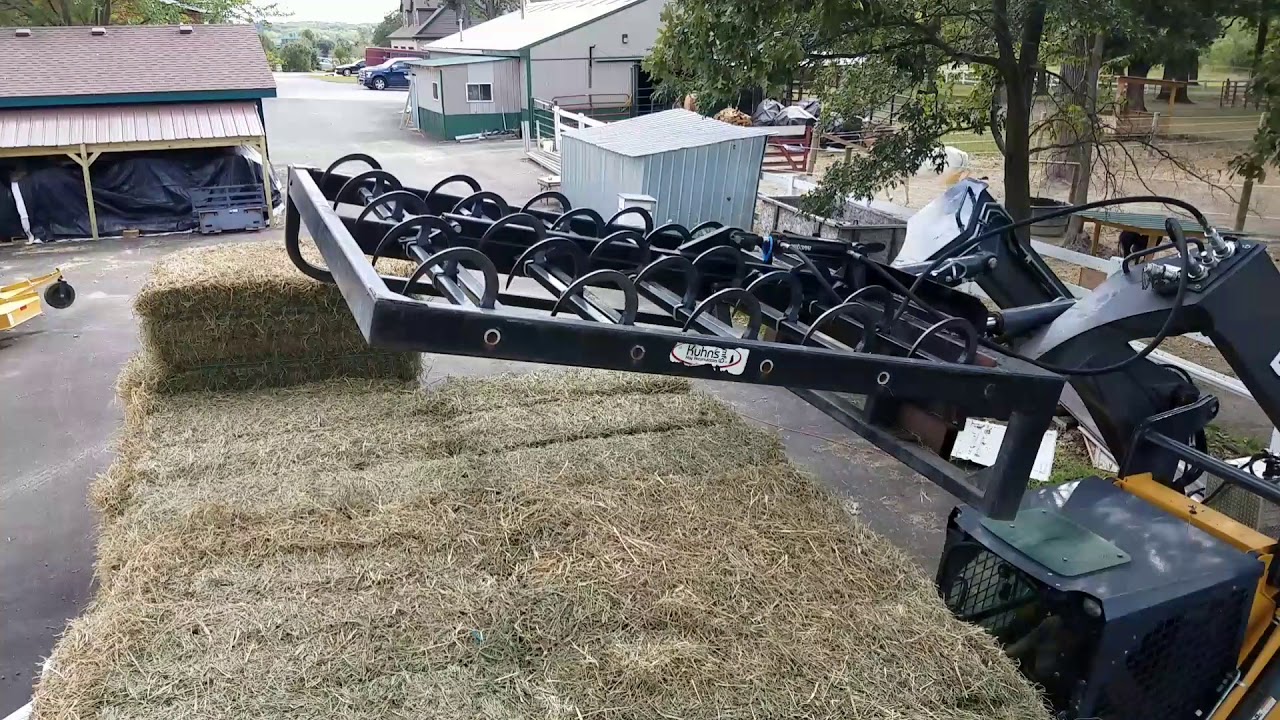 Kuhn 10 bale on edge hay grabber, unloading (3)