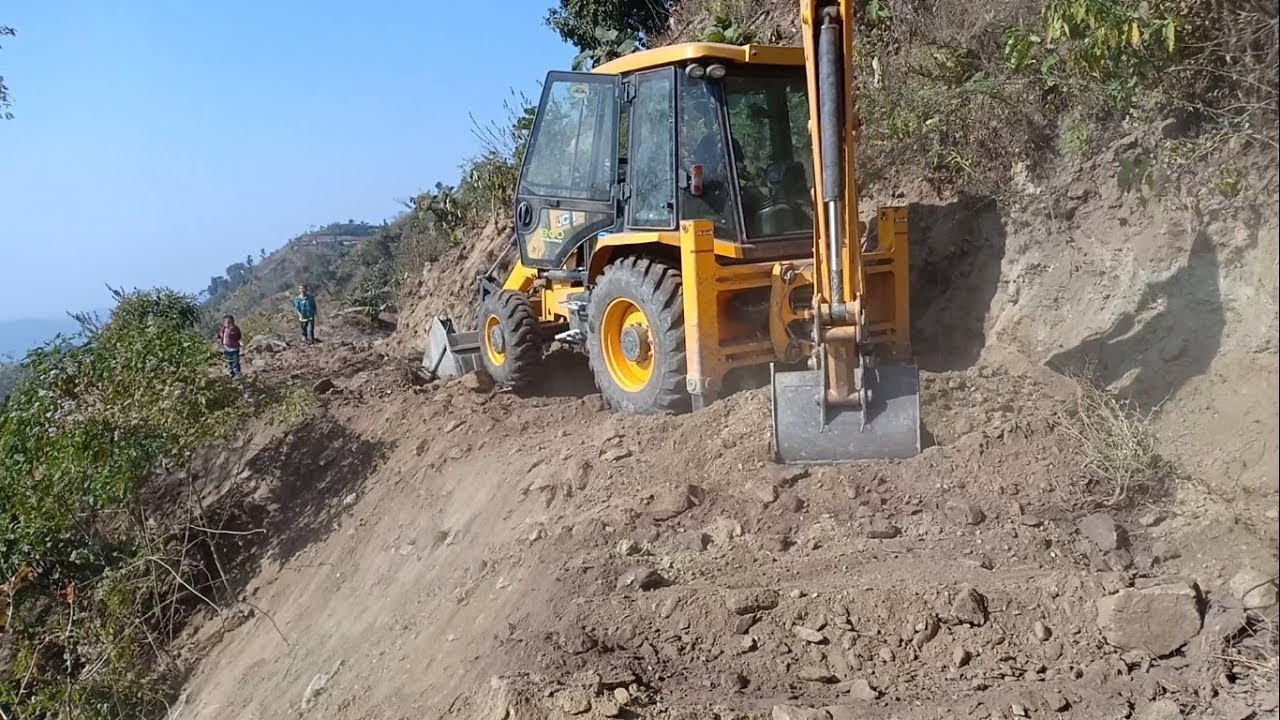 Hard Working JCB Backhoe Operator-Widening Narrow Hill Track