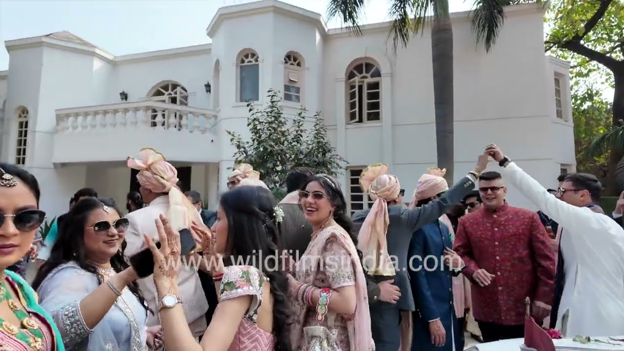 Big Indian Wedding at a Delhi farm house, with a loud band, a vintage car and lots of drumming