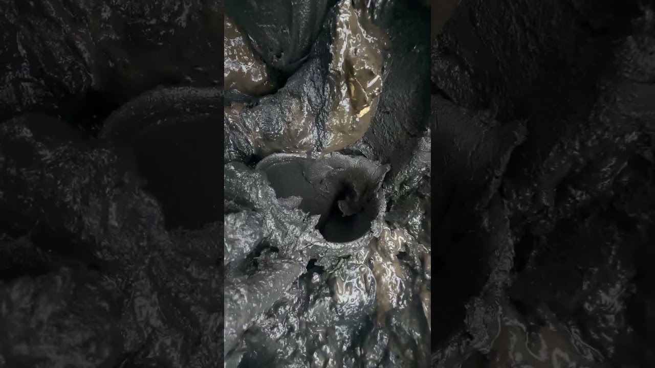 Boots stuck in bottomless tidal mud