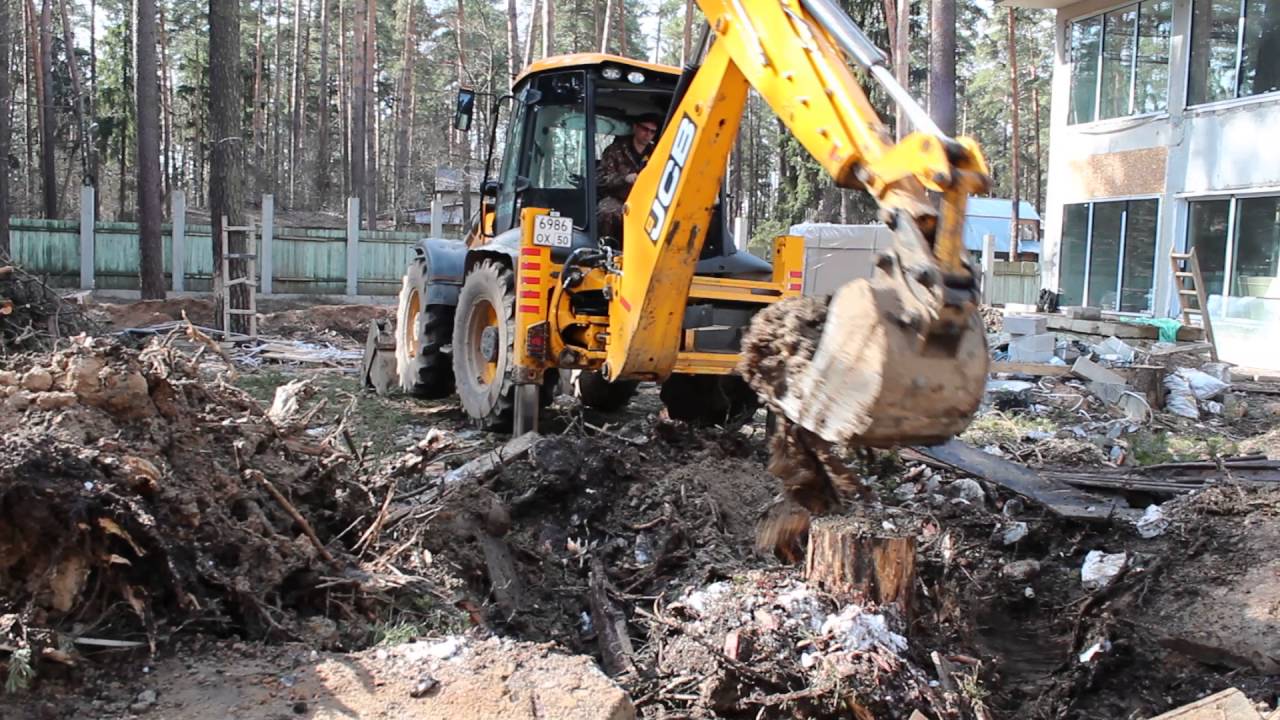 Корчевание пня экскаватором JCB (www.pro-alpinizm.ru)