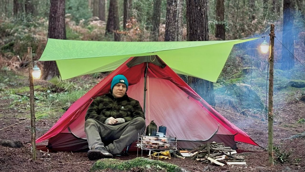 Camping In a Rainstorm With a Campfire