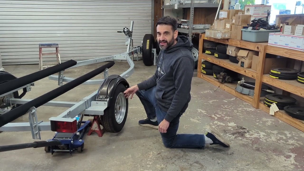 EZ Loader Boat Trailers Owner's Manual: How to Check Wheel Hub Bearings with Rock and Roll Test
