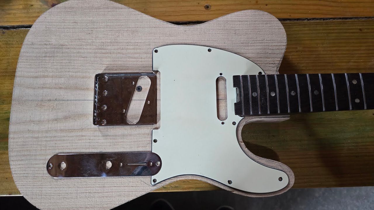 Guitar repair. working on templates, scale length, and getting ready for routing and sanding. tele